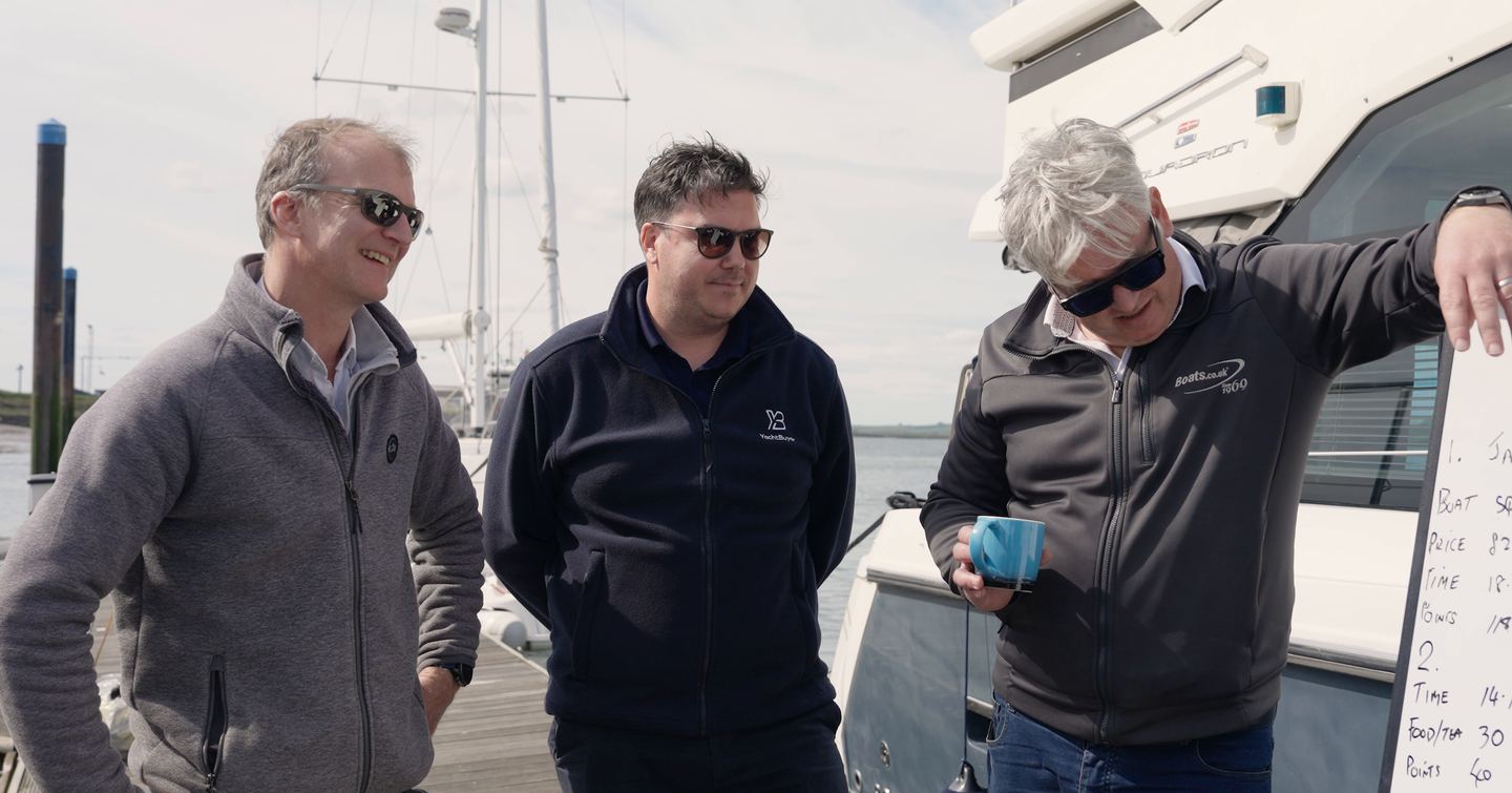 Hugo Andreae, Jack Haines and James Barke reviewing the handwritten challenge scores at Essex Marina during YachtBuyer's £300,000 Prop Gear used boat competition.