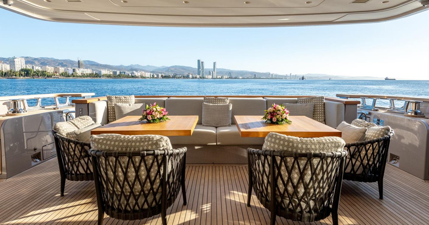 Motor yacht Speranza II's aft deck shaded dining area