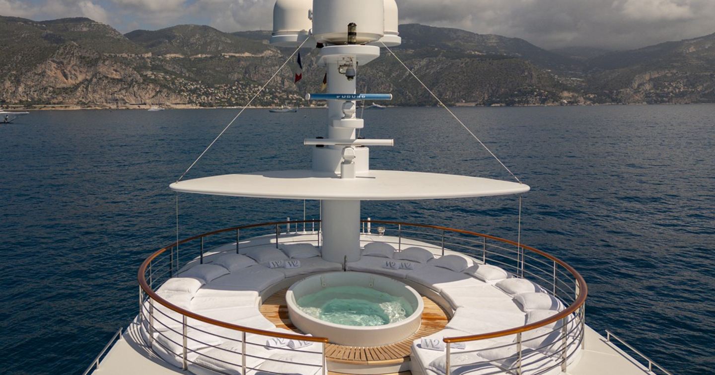 Wedge Too yacht sundeck with circular Jacuzzi and sunpads