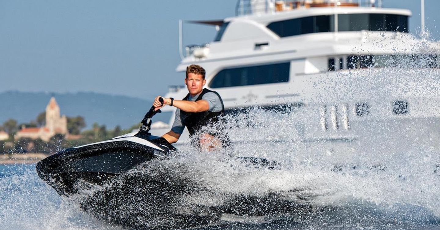 Man on jet skis in front of Trinity superyacht White Star