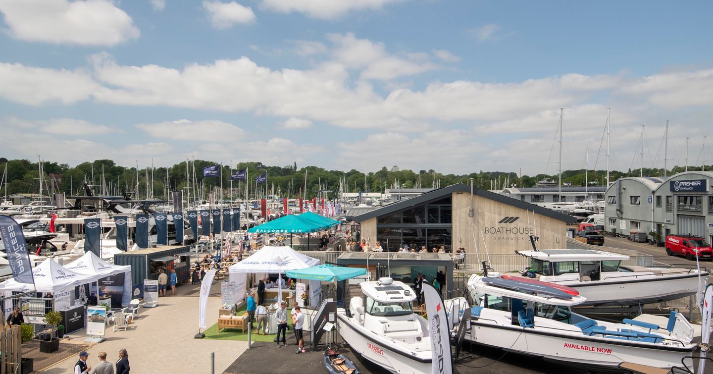 Overview of British Motor Yacht Show with yachts on land and Boathouse 