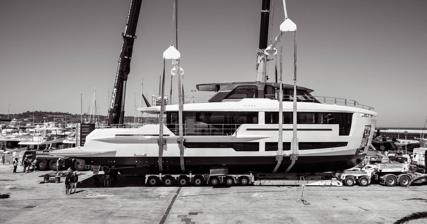 Fourth Alpha Squalo 100 superyacht suspended by cranes during launch