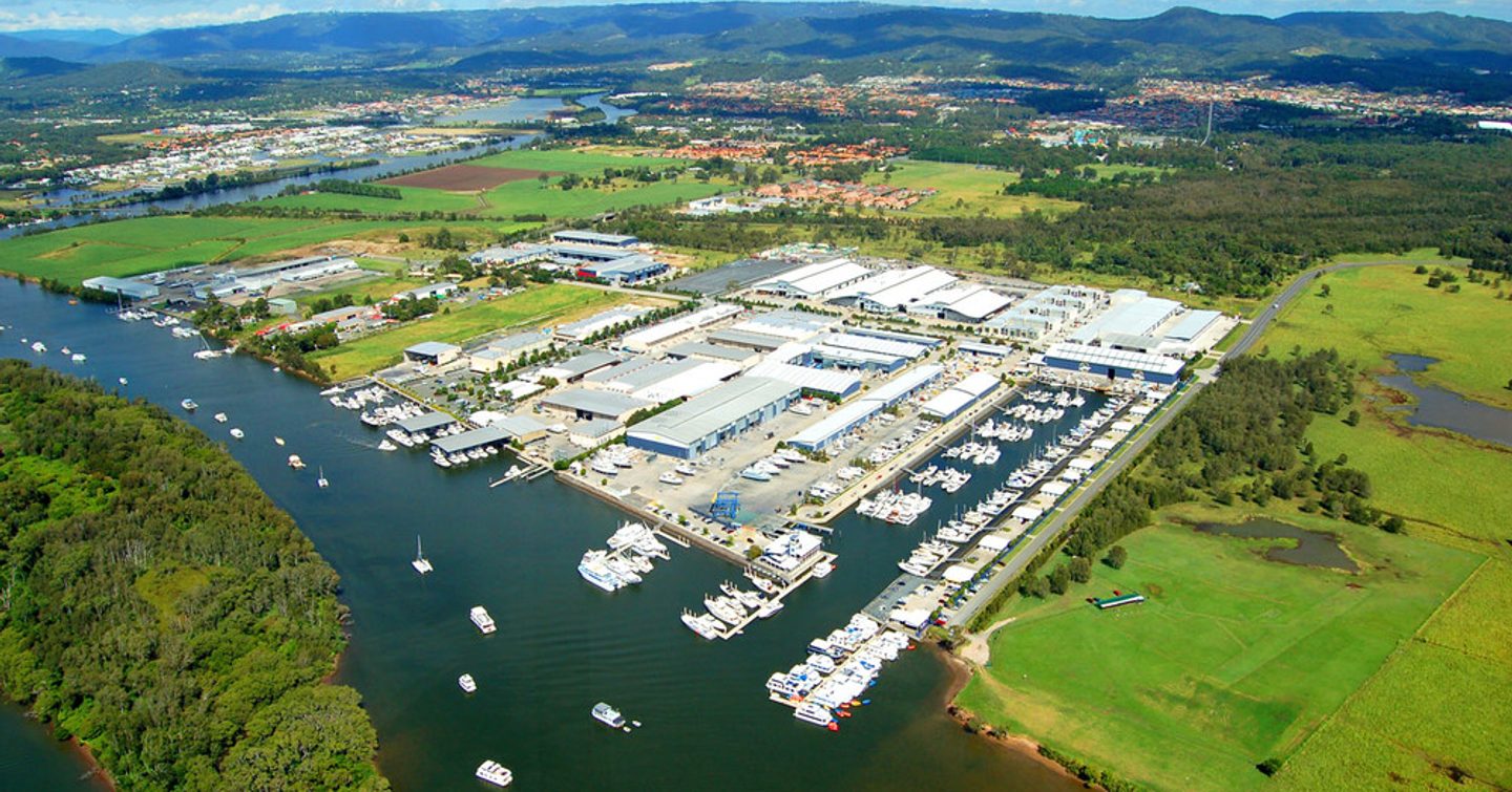 Aerial view of GCCM marina, surrounded by green countryside and sea