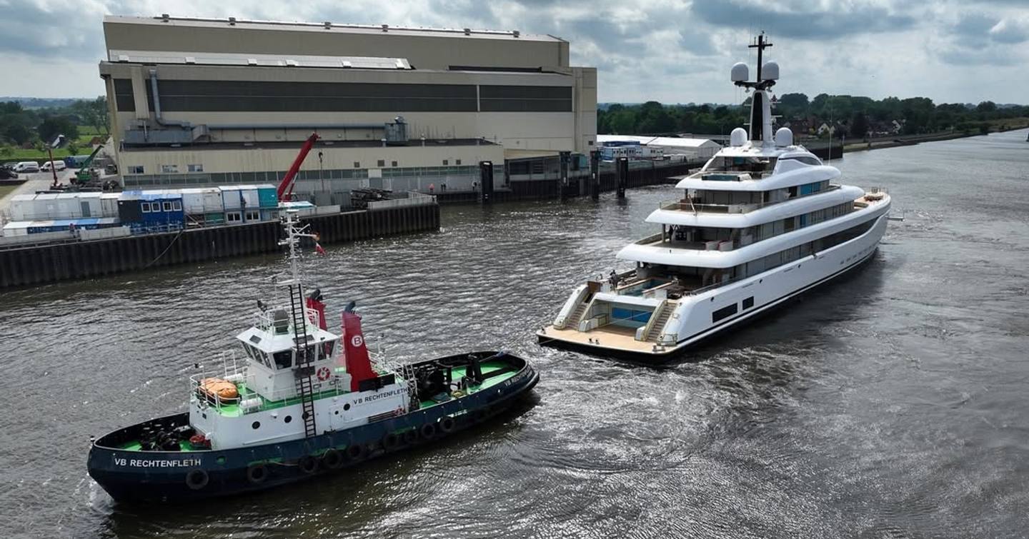 Superyacht Act 21 underway with tugboat  following 