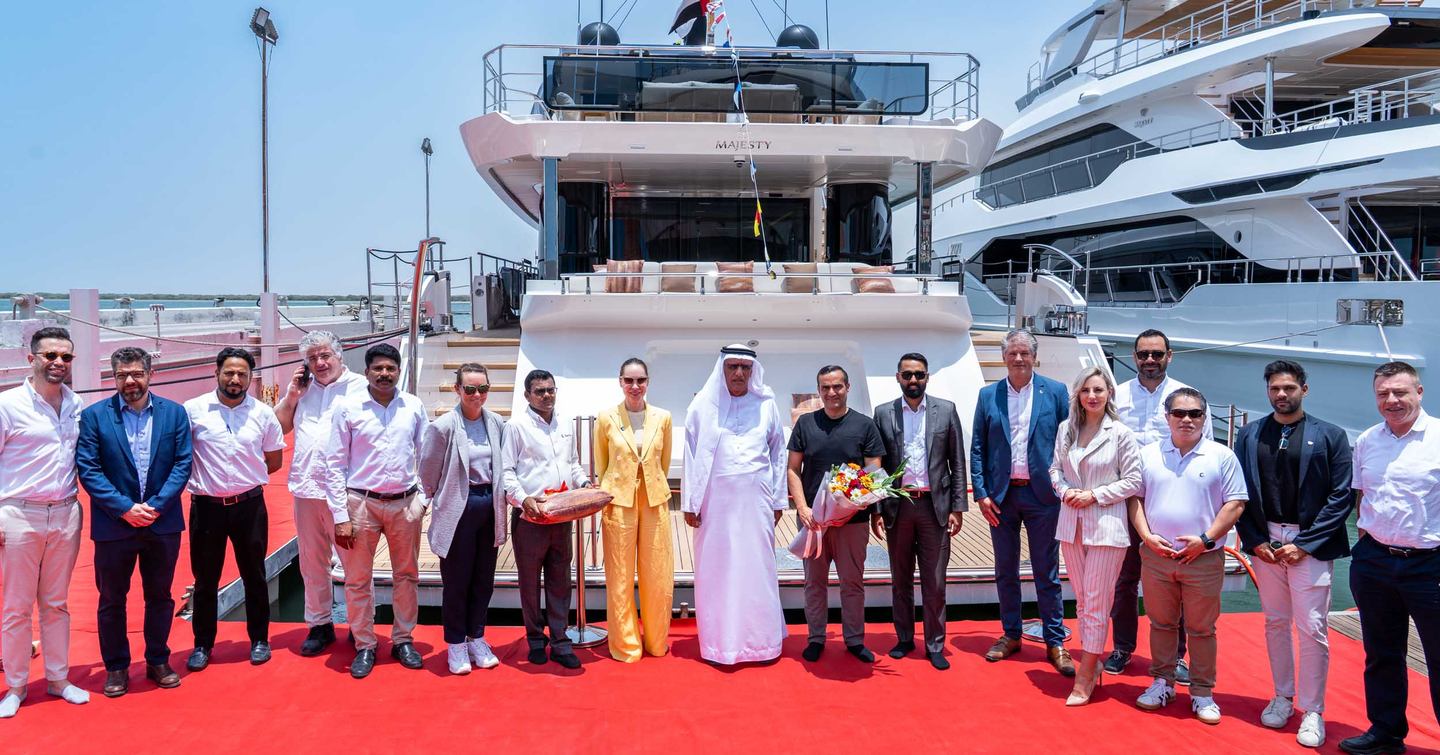 Gulf Craft team and superyacht owners in front of First Majesty 100 Terrace Superyacht
