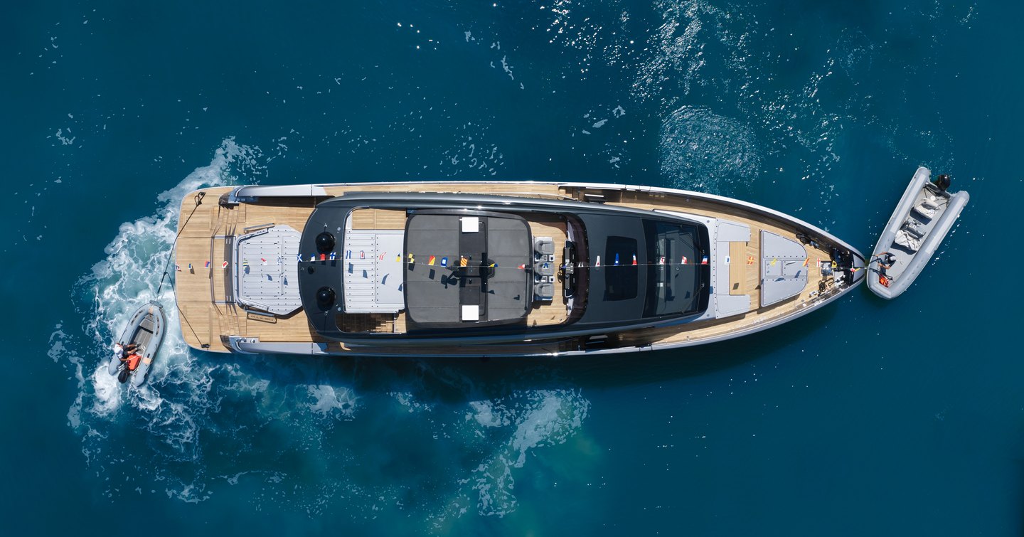 First Pershing GTX90 motor yacht at anchor aerial view 