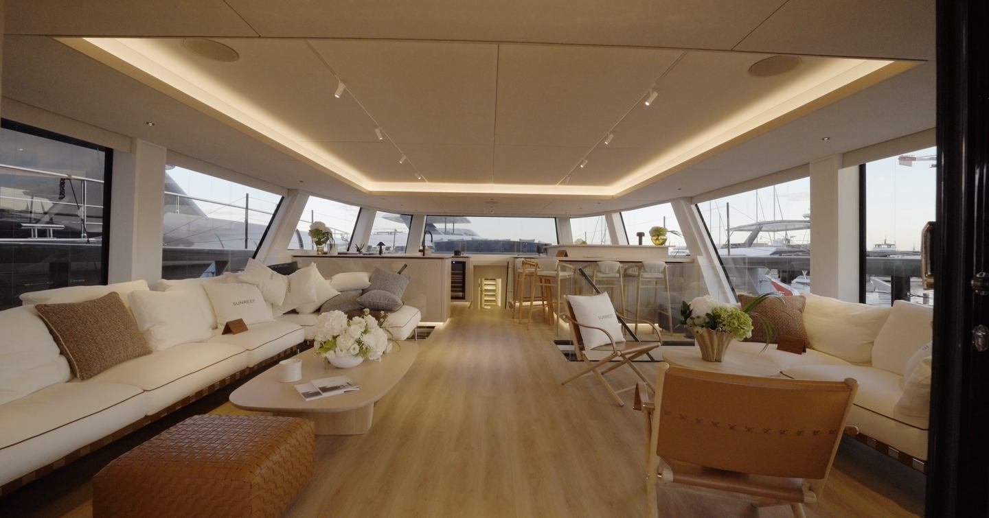 Sunreef Ultima 88 saloon with freestanding sofas, wide glazing and open-plan layout