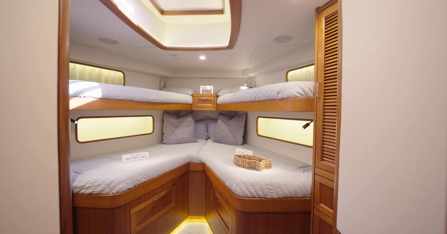 Fleming 85 quad-berth guest cabin with custom bunk layout for family cruising