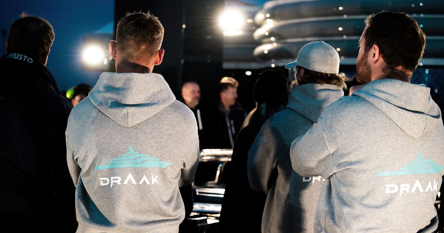 Workers at Superyacht Draak sea trials with Draak sweaters