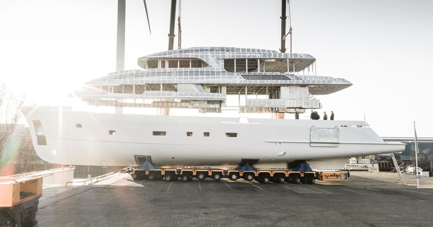 Superstructure being lowered onto hull of Ninth Moonen 122 Martinique superyacht 