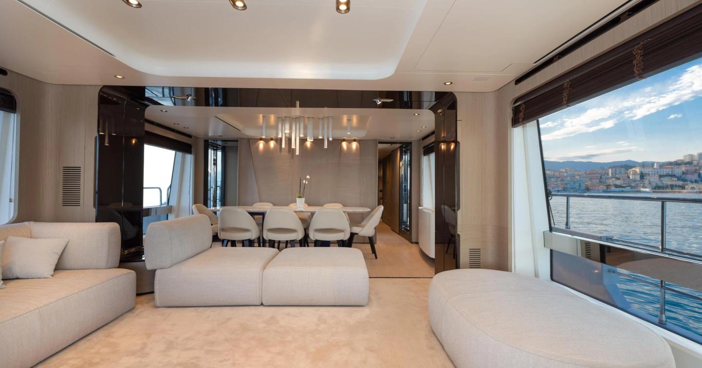 Motor yacht Dambar main saloon with flat, cream furniture