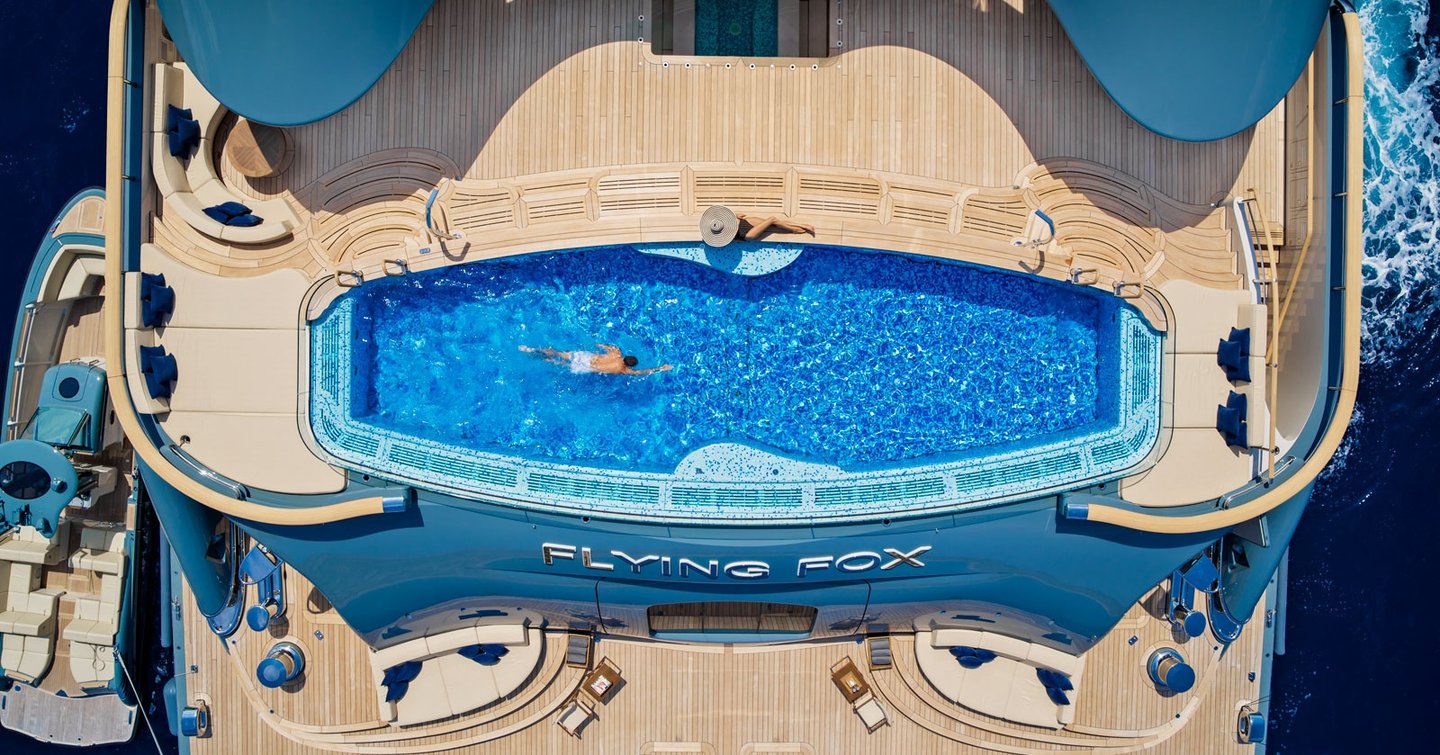 A top-down aerial shot of the 12m pool onboard Lurssen superyacht FLYING FOX