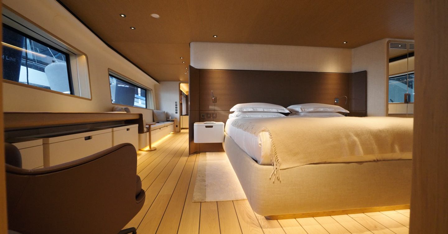 Custom Line Navetta 38 owner’s cabin with full beam layout, large windows and double bed on main deck