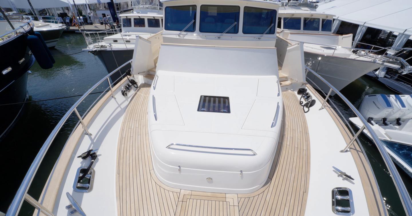 Fleming 85 foredeck with Portuguese bridge access, hidden seating and wide walkaround decks