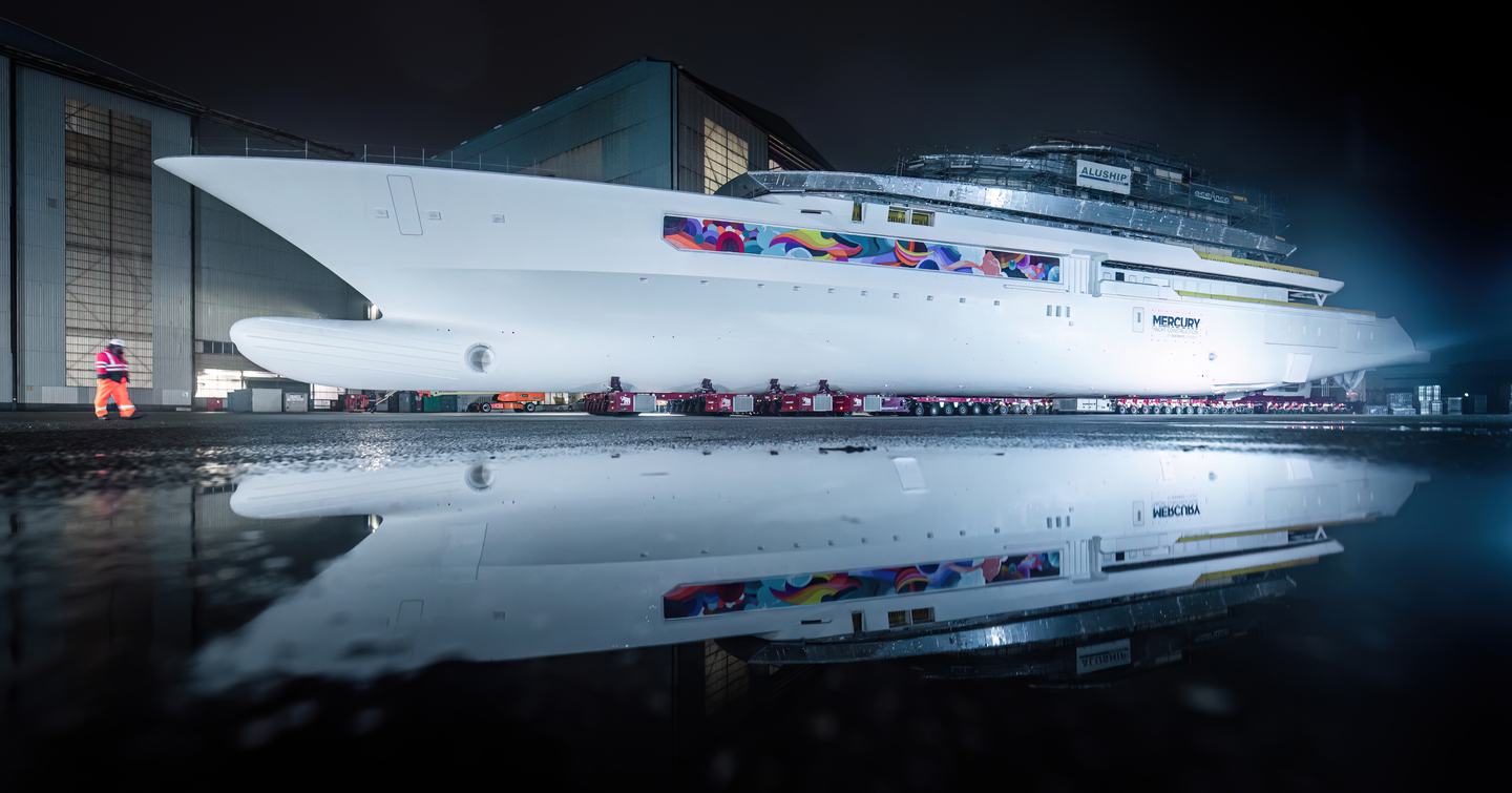 Superyacht DreAMBoat at night before launch 