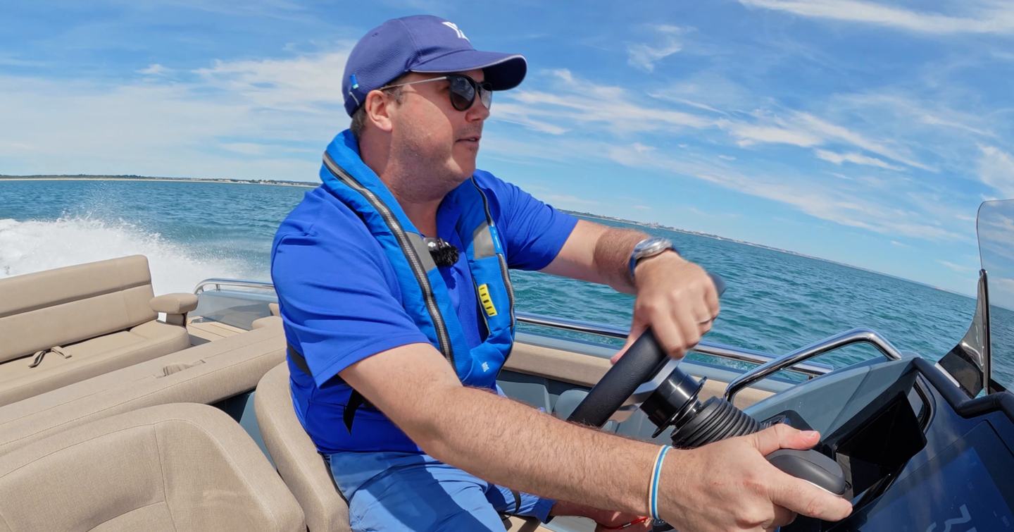 Driver seated at the helm of the Evene Origin 71 during sea trial