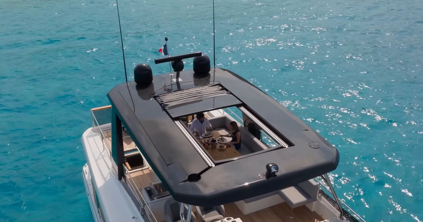 Beneteau Grand Trawler 63 flybridge hardtop with opening sunroof above the outdoor dining area
