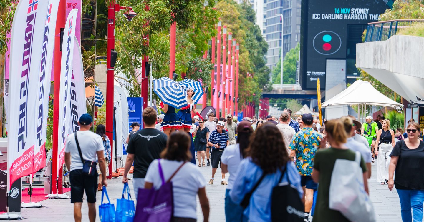 Women on stilts at Sydney International On-Water Boat Show