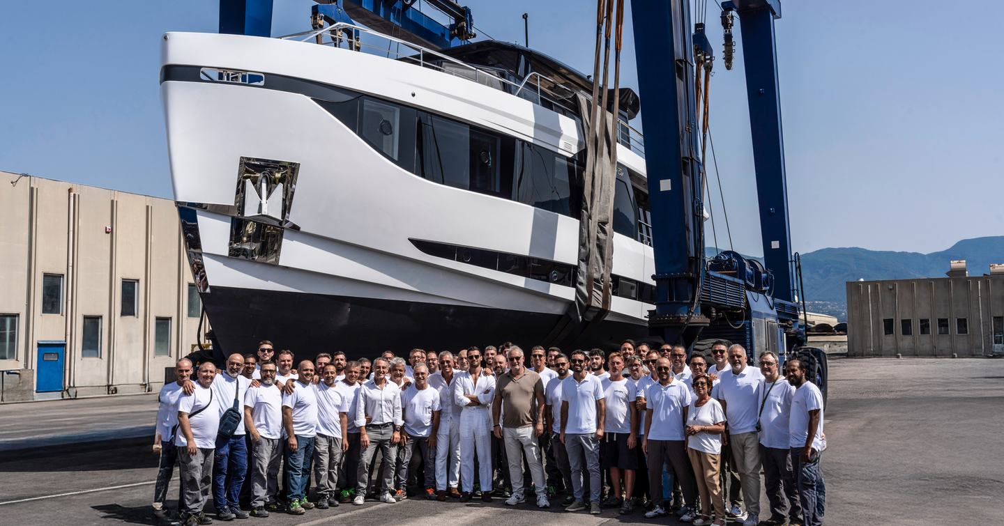 The Arcadia Yachts team gathers in front of the first A80 during its launch at the Sorrento shipyard.