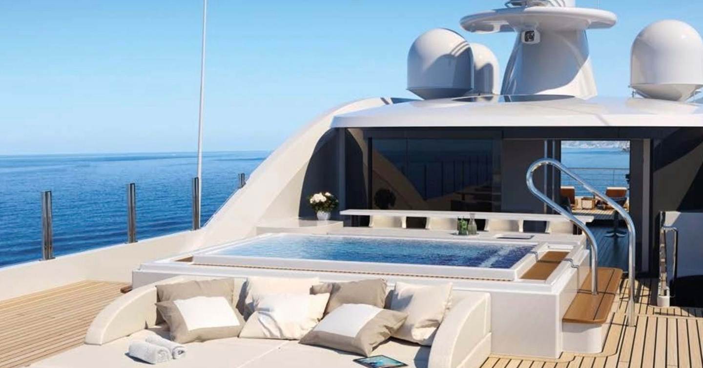 Superyacht Moonstone's sundeck with sunpads and pool