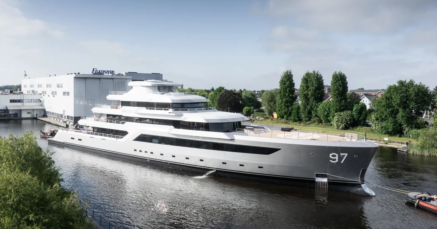 Superyacht VALOR being escorted away from construction shed