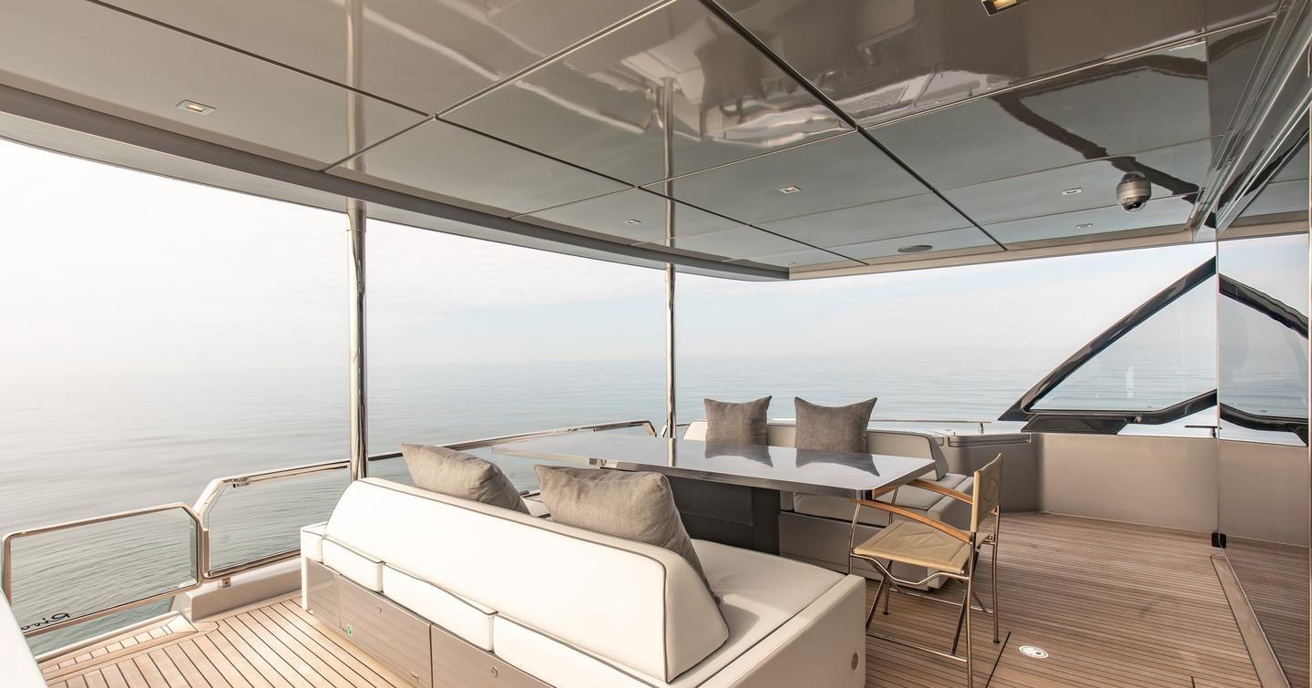Motor Yacht T57's aft deck with alfresco dining