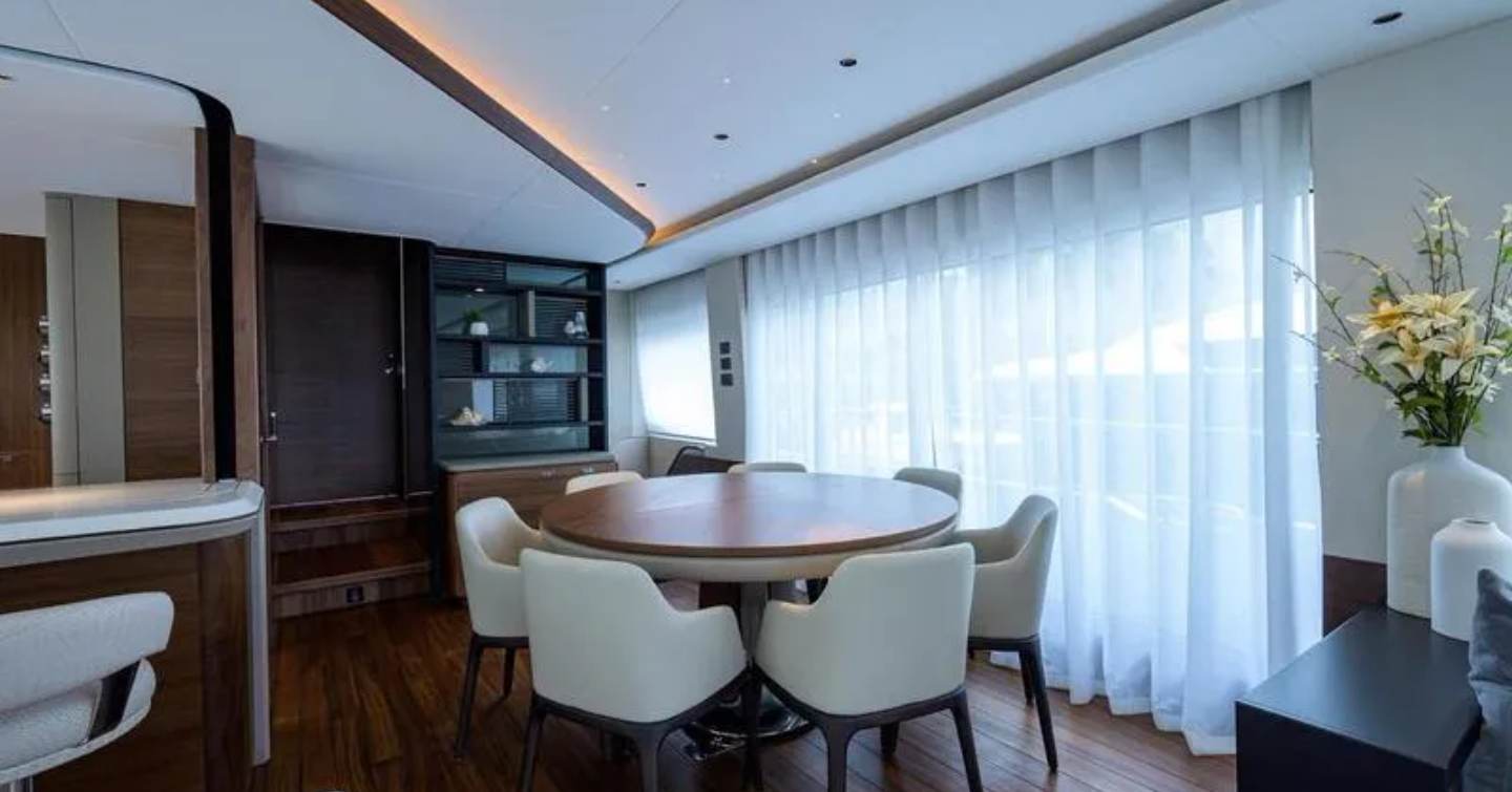 Circular dining table on Motor Yacht Escape 