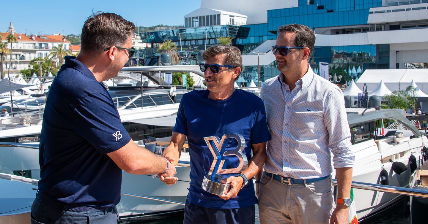 YachtBuyer Hall of Fame handover for Bluegame BG42 from CEO Kevin Bodington and Jack Haines
