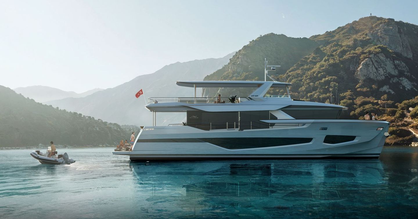 Motor yacht 27XP at anchor with a view of her tender