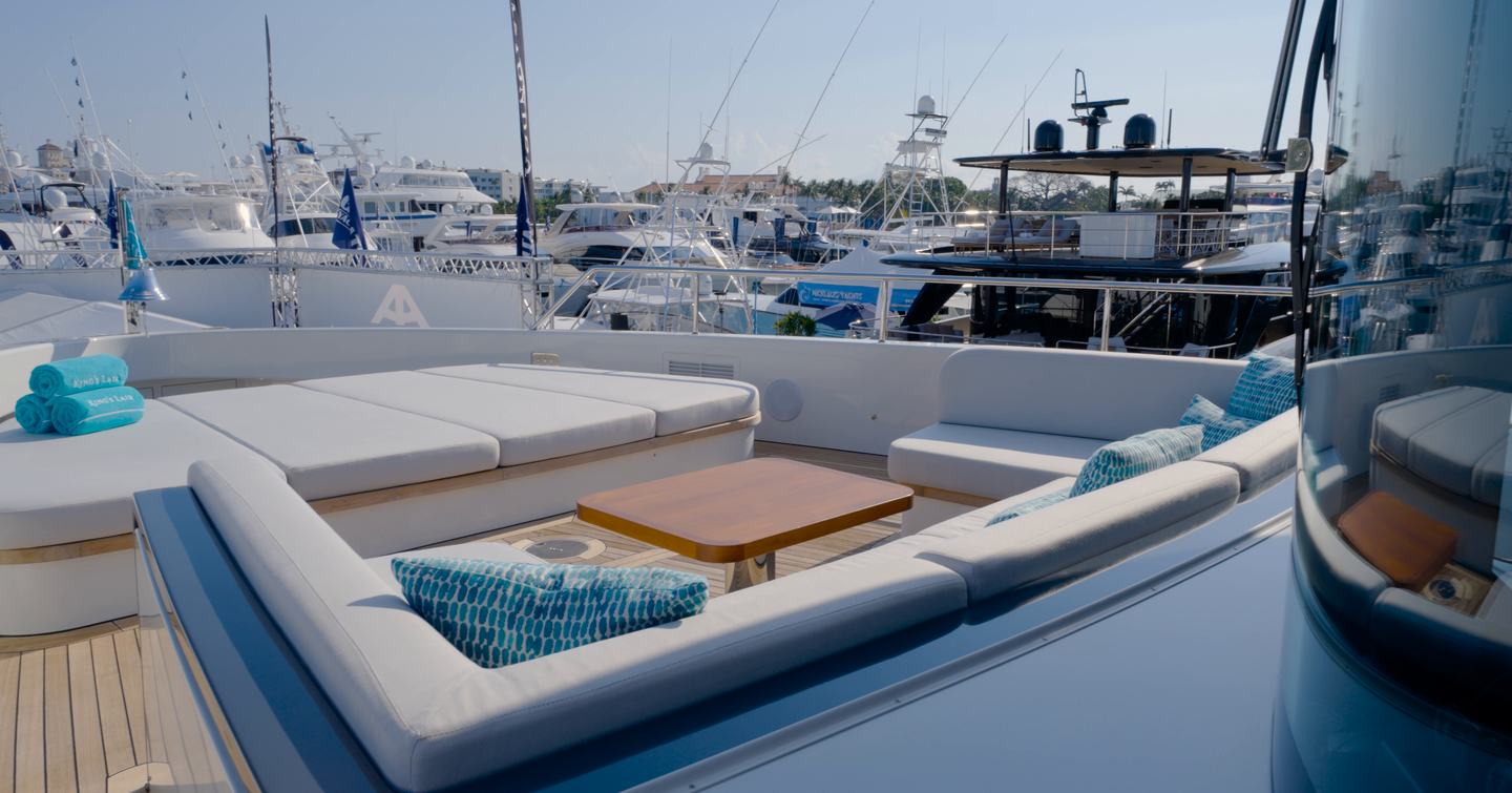Benetti Oasis 34M foredeck lounge with wraparound seating, cocktail table and large forward sunpad.