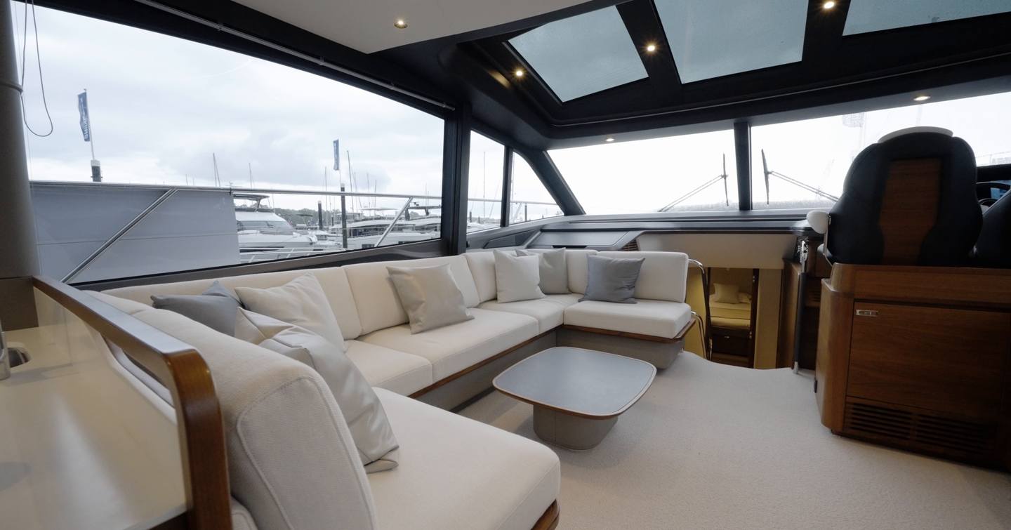 Princess S65 Mk2 saloon with U-shaped sofa, large windows and glazed sunroof