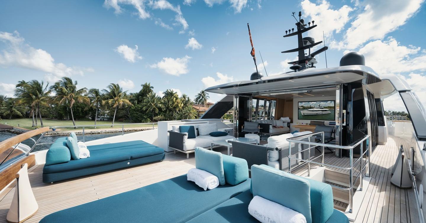 Motor yacht Don't Tell Mom's upper deck sunpads 