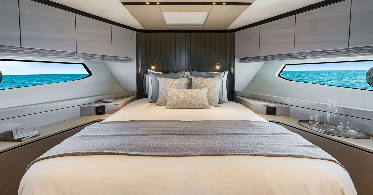 Owner's cabin on motor yacht Manhattan 68 with large bed and sea views 