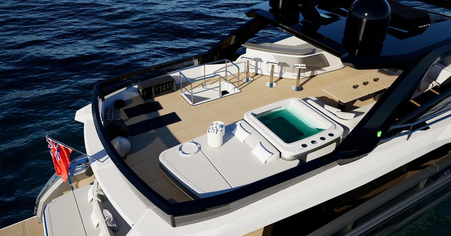 Flybridge of Pearl 100 Hybrid motor yacht with Jacuzzi, sun loungers, and bar area overlooking the sea