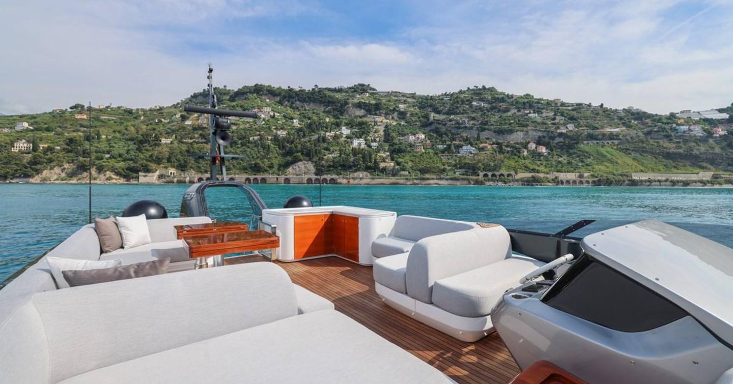 YB flybridge with seating and sunbathing areas