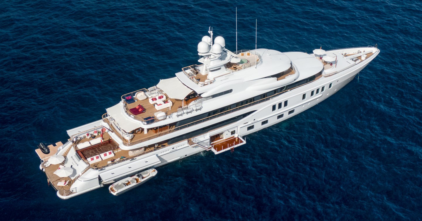 Superyacht Synthesis at anchor with fold out balcony and tender pre-refit 