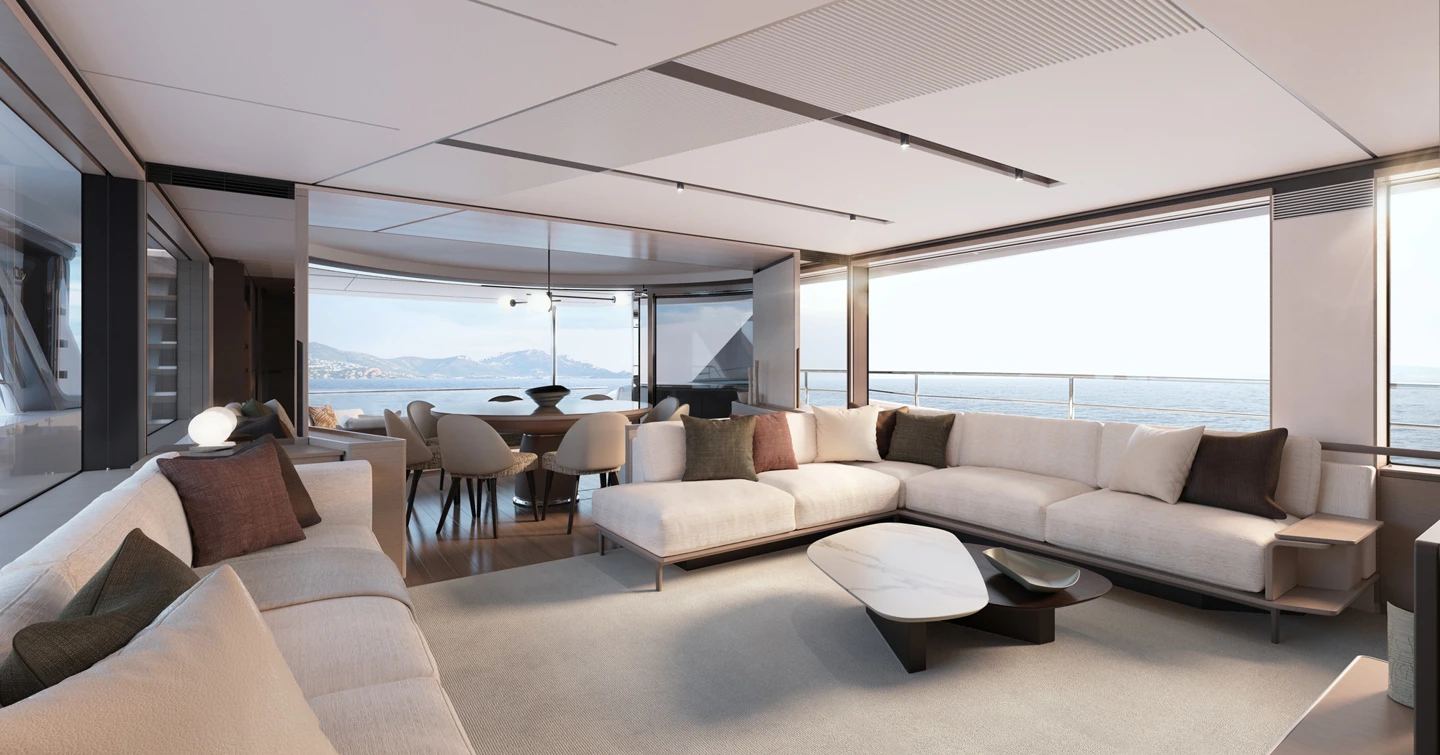 Rendering of Princess X90 motor yacht main saloon with L-shaped white sofa and aft dining area 