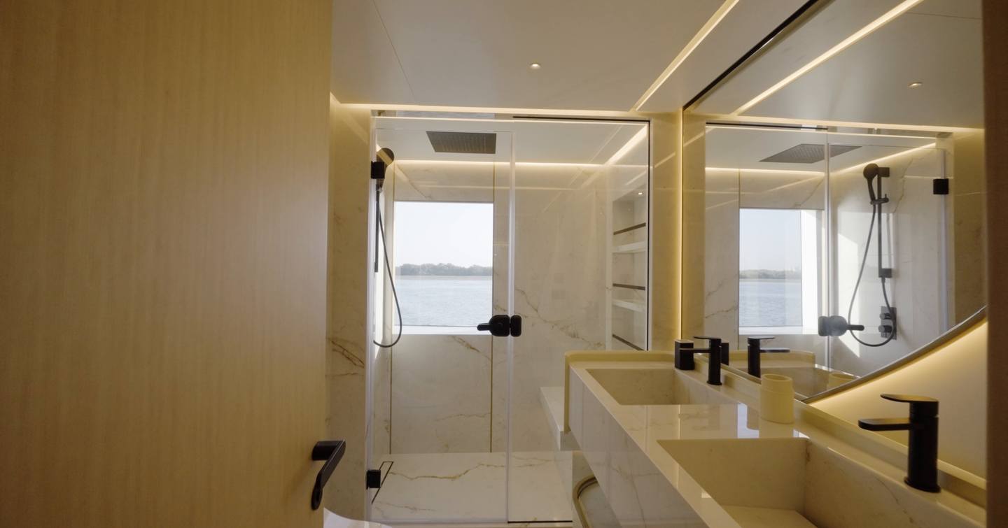 Owner's ensuite bathroom aboard the Gulf Craft Majesty 100 Terrace with twin basins and large shower
