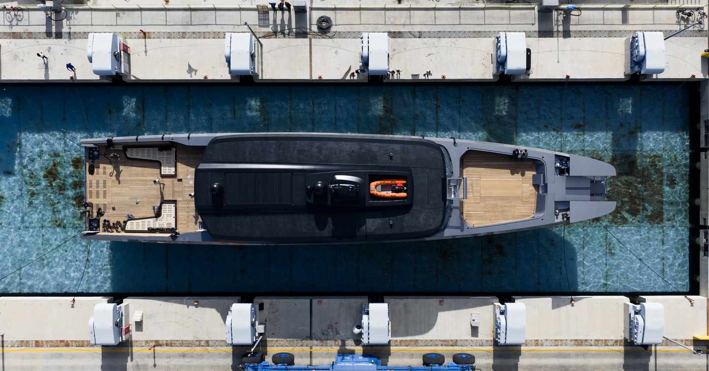 Aerial view of Superyacht Atlantide being lowered into water at launch