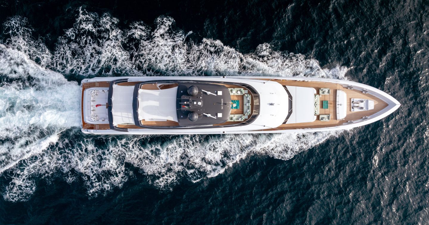 Motor boat ALP pictured from above, cruising on the water 