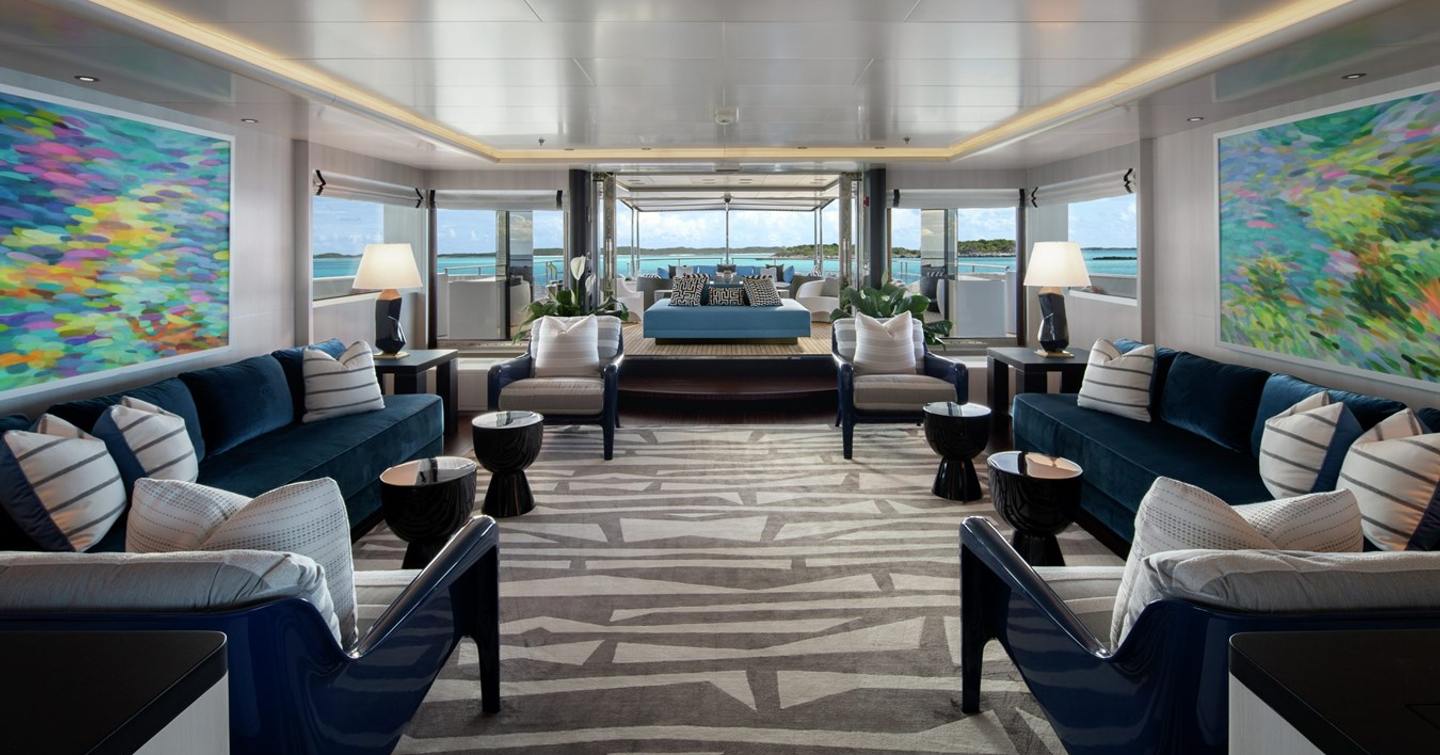 Superyacht Eternity's main saloon with L-shaped sofas 