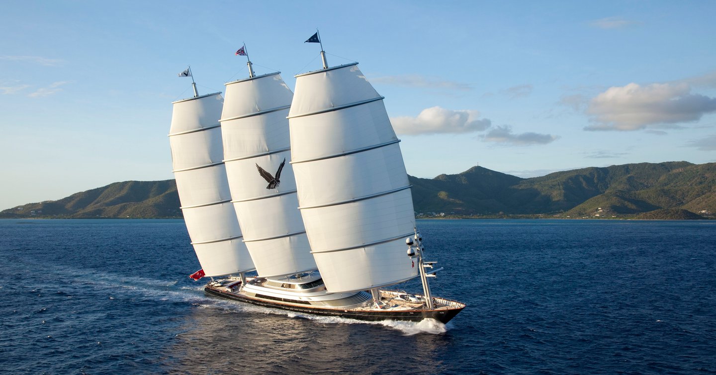 Maltese Falcon on water with rugged coastline behind