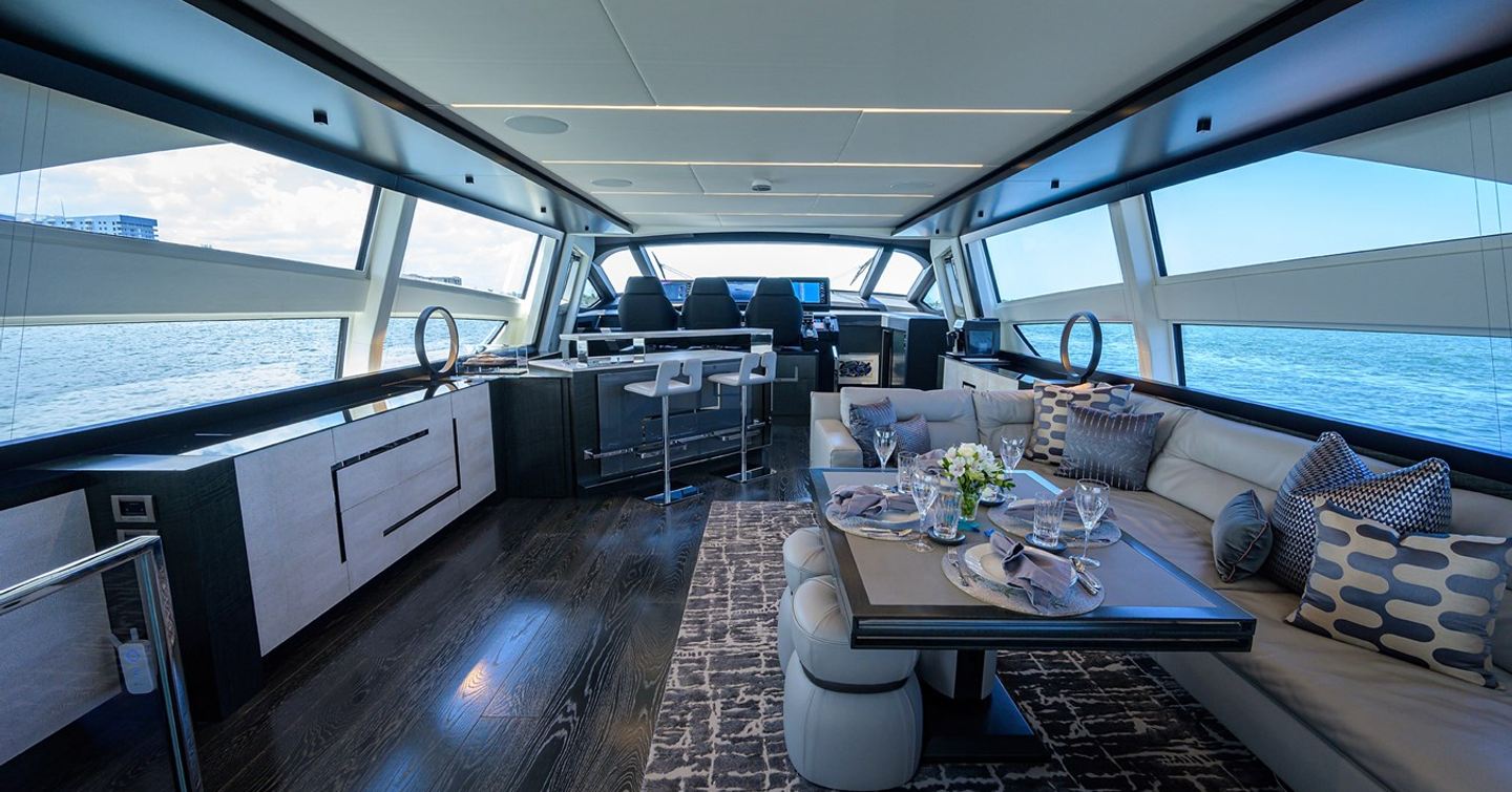 Motor yacht Shine's interior with seating and bar area