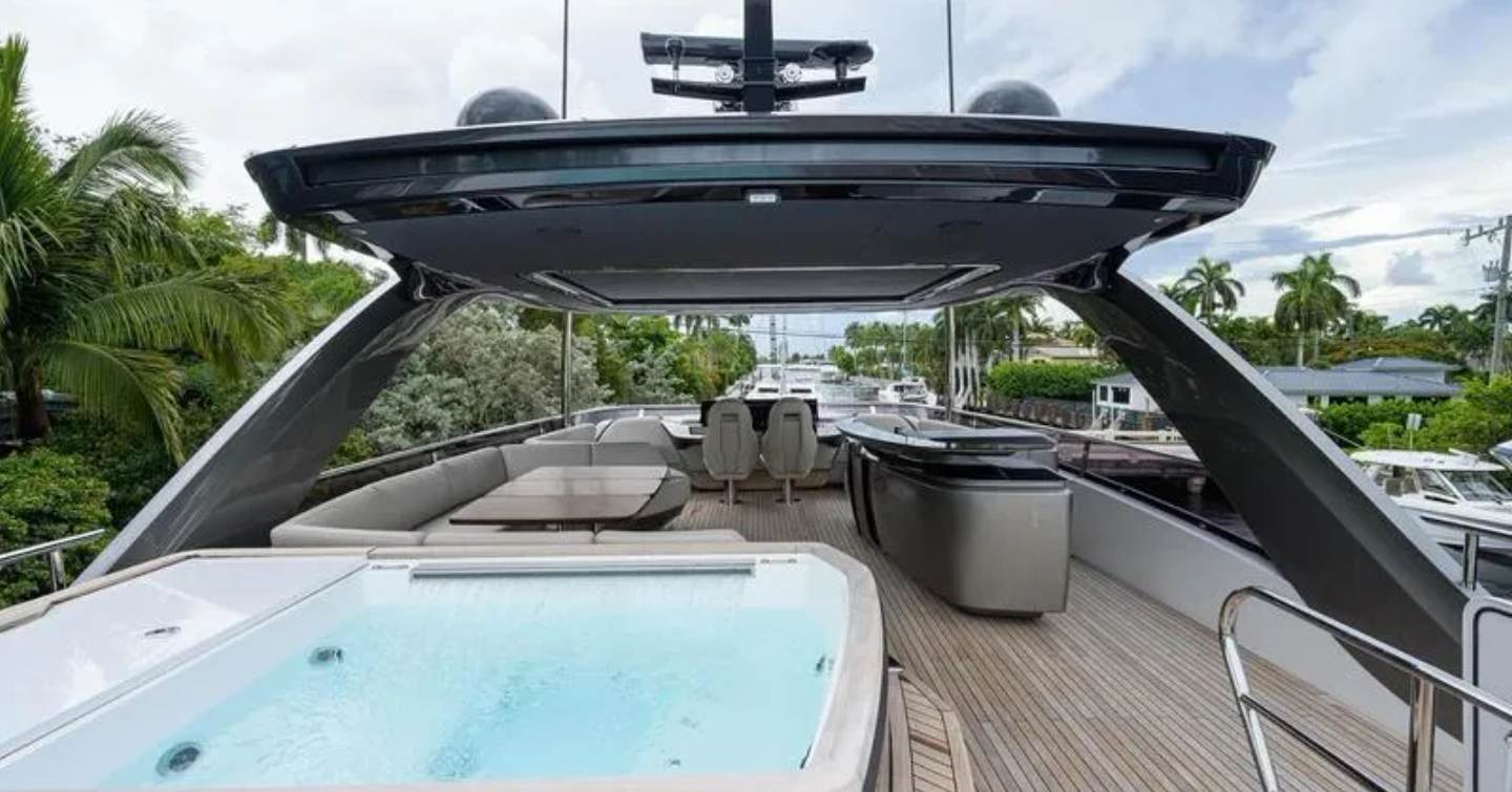 Upper deck of Motor Yacht Escape with jacuzzi, bar area and seating