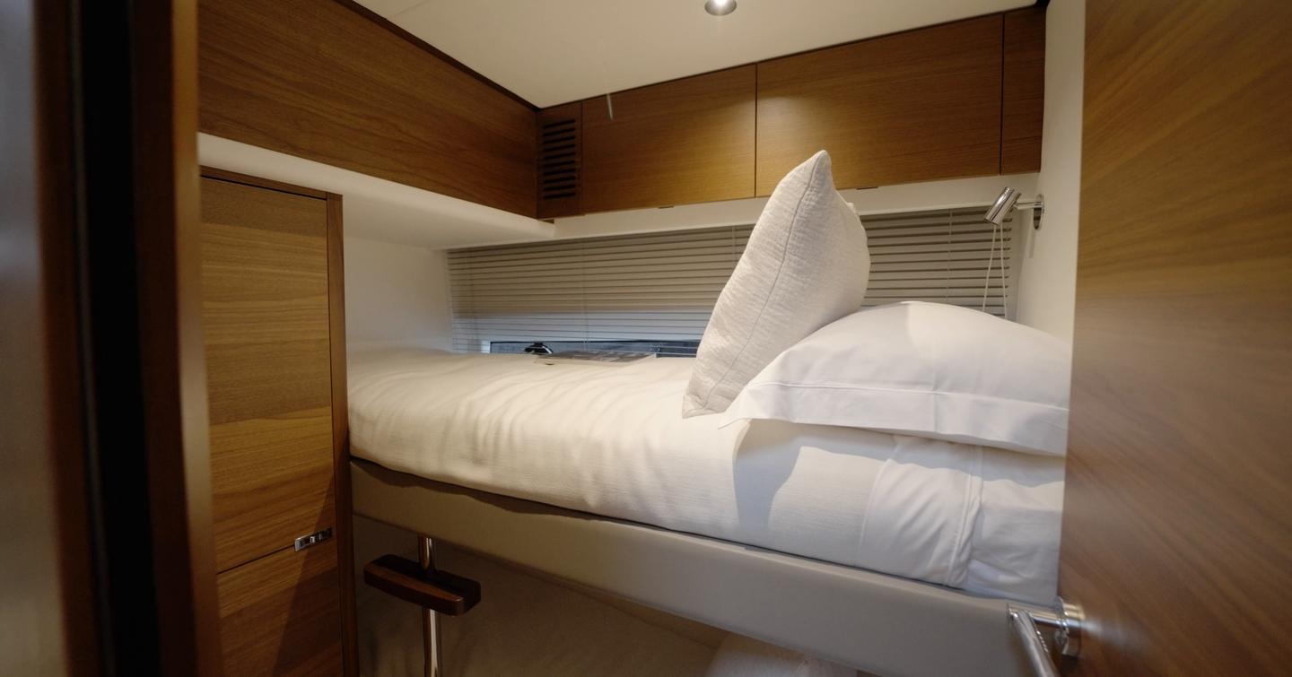 Princess S65 Mk2 bunk guest cabin with stacked berths, hull window and walnut storage
