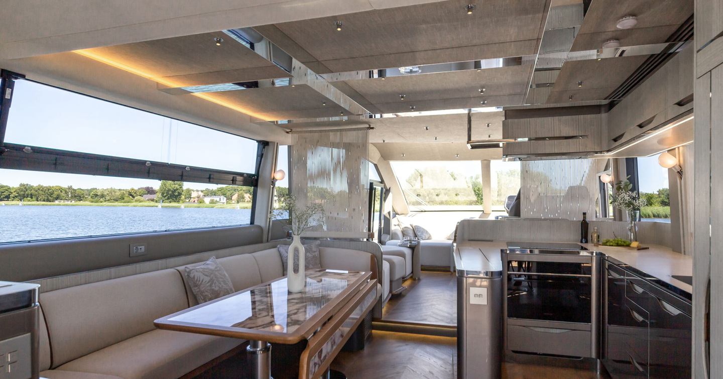 Galeon 620 Fly motor yacht interior with L-shaped seating and galley