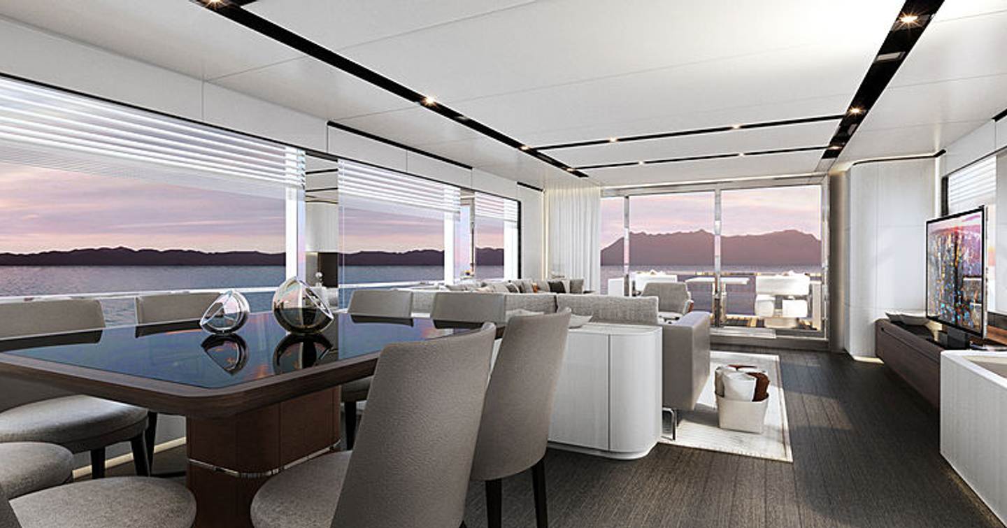 glass-topped dining table surrounded by white chairs in front of sofa on the upper deck of the Astondoa AS8 yacht