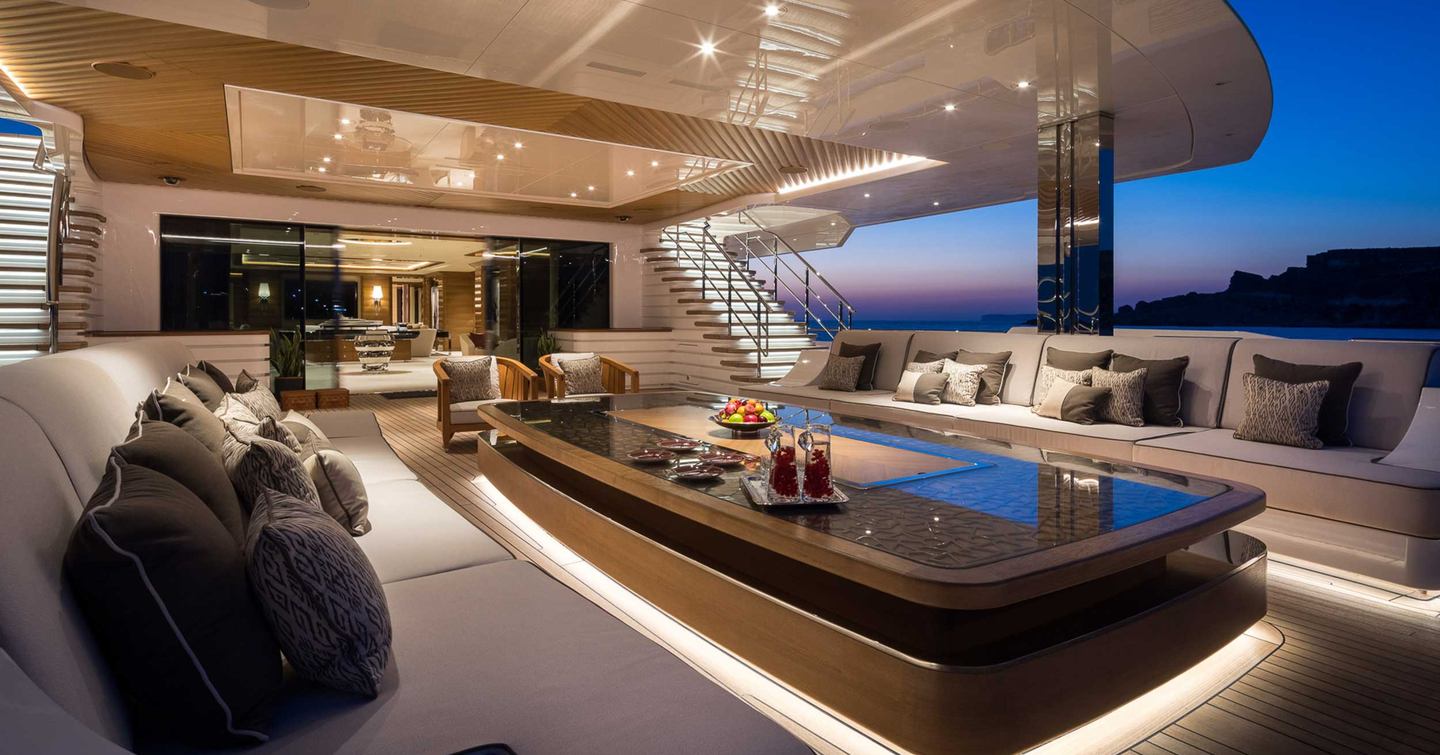 Superyacht Mar aft deck with marble table and white furniture 