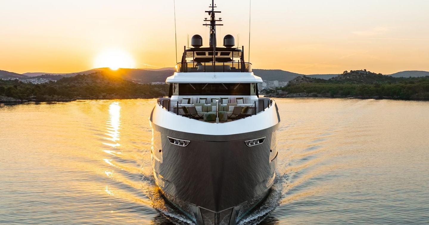 Bow shot of the motor yacht Gisa with sunset in the background 