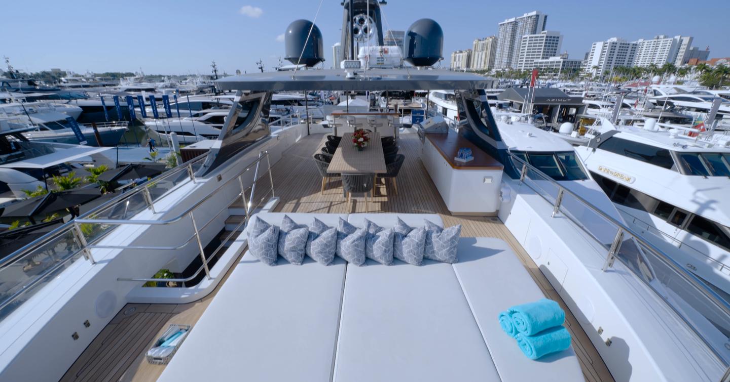 Benetti Oasis 34M sundeck featuring forward sunpad, outdoor dining space and panoramic views.